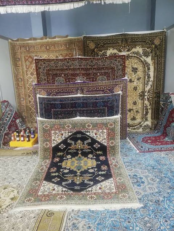Rugs hung for selection in the showroom